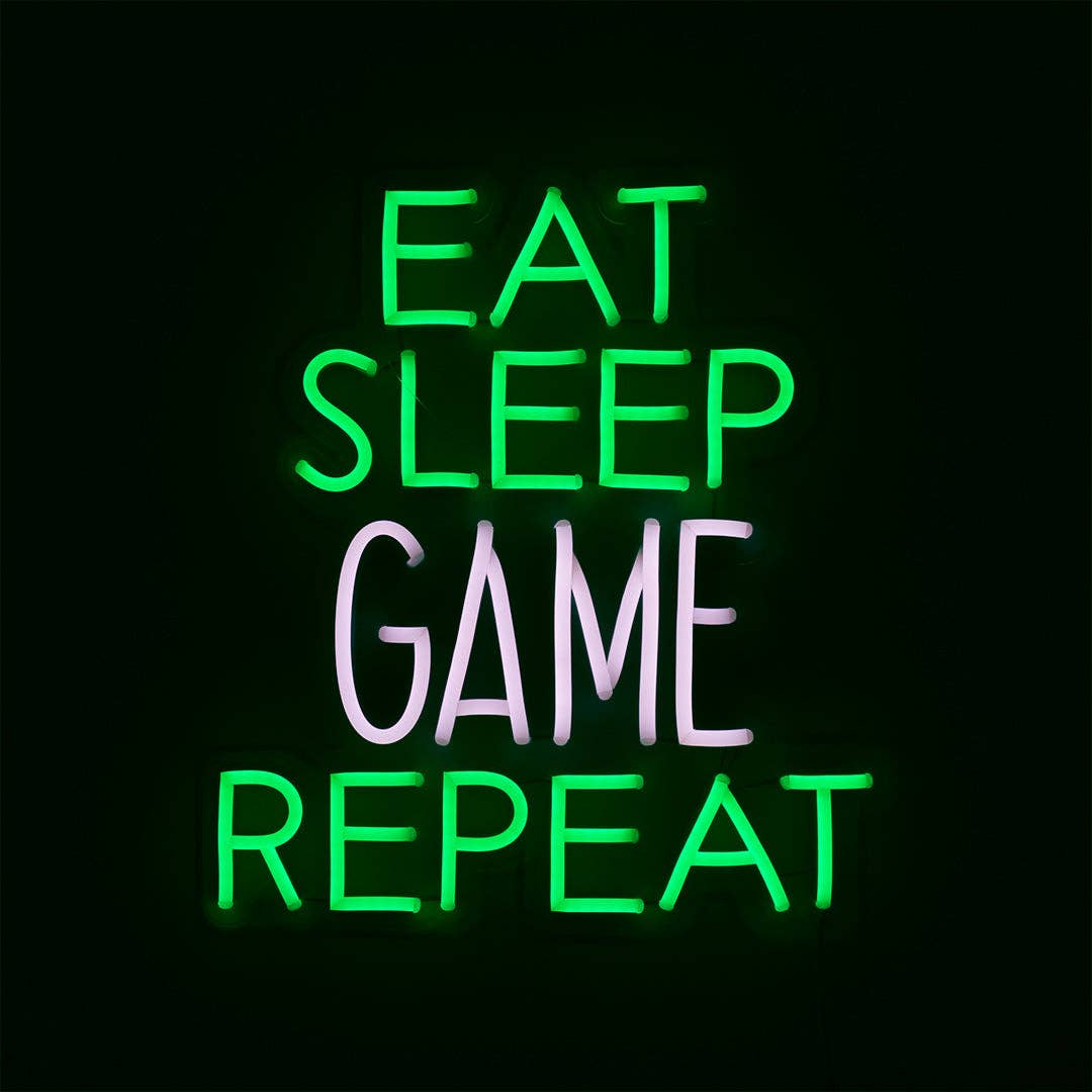 Neon sign with 'Eat Sleep Game Repeat' text on a black background