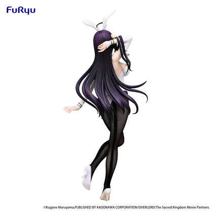 Anime character figurine with long black and purple hair on a white background, featuring the Furyu logo.