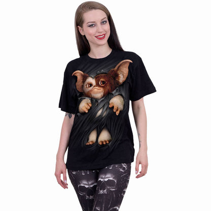Person wearing a black t-shirt with a graphic design of a creature on a white background