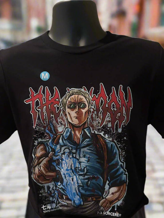 Black t-shirt with graphic design of a character holding a gun on a mannequin against a blurred background.