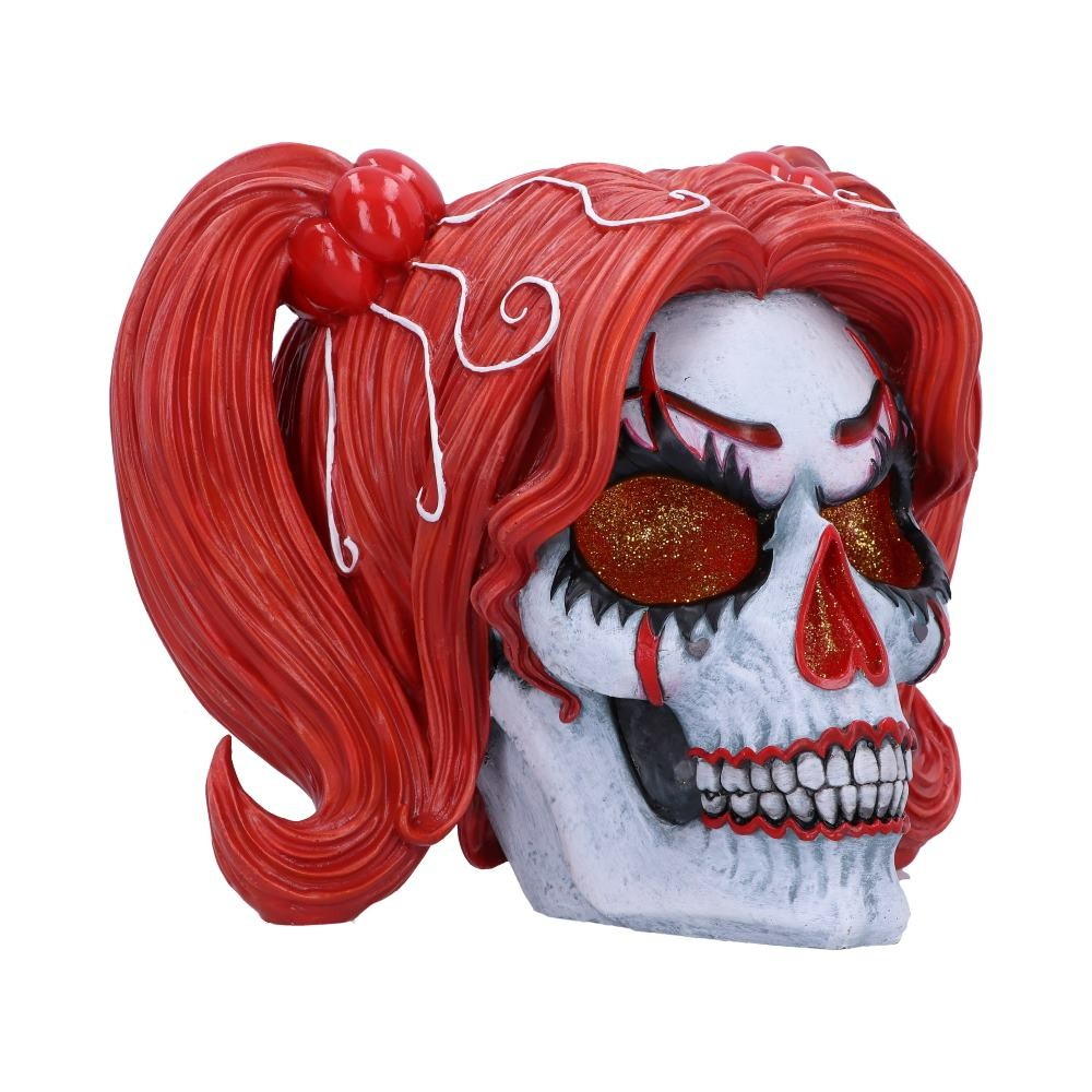 Skull with red hair styled in pigtails on a white background