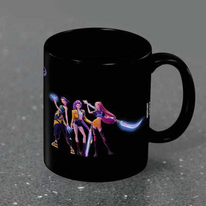 Black mug with colorful character design on a gray background