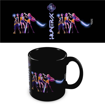 Black mug with colorful band illustration and 'Huntrax' logo on a white background