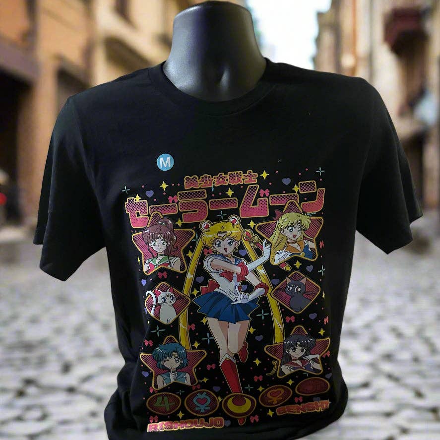 Black t-shirt with colorful graphic design featuring characters on a mannequin against an urban background. Sailor Moon