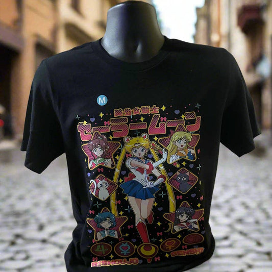 Black t-shirt with colorful graphic design featuring characters on a mannequin against an urban background. Sailor Moon