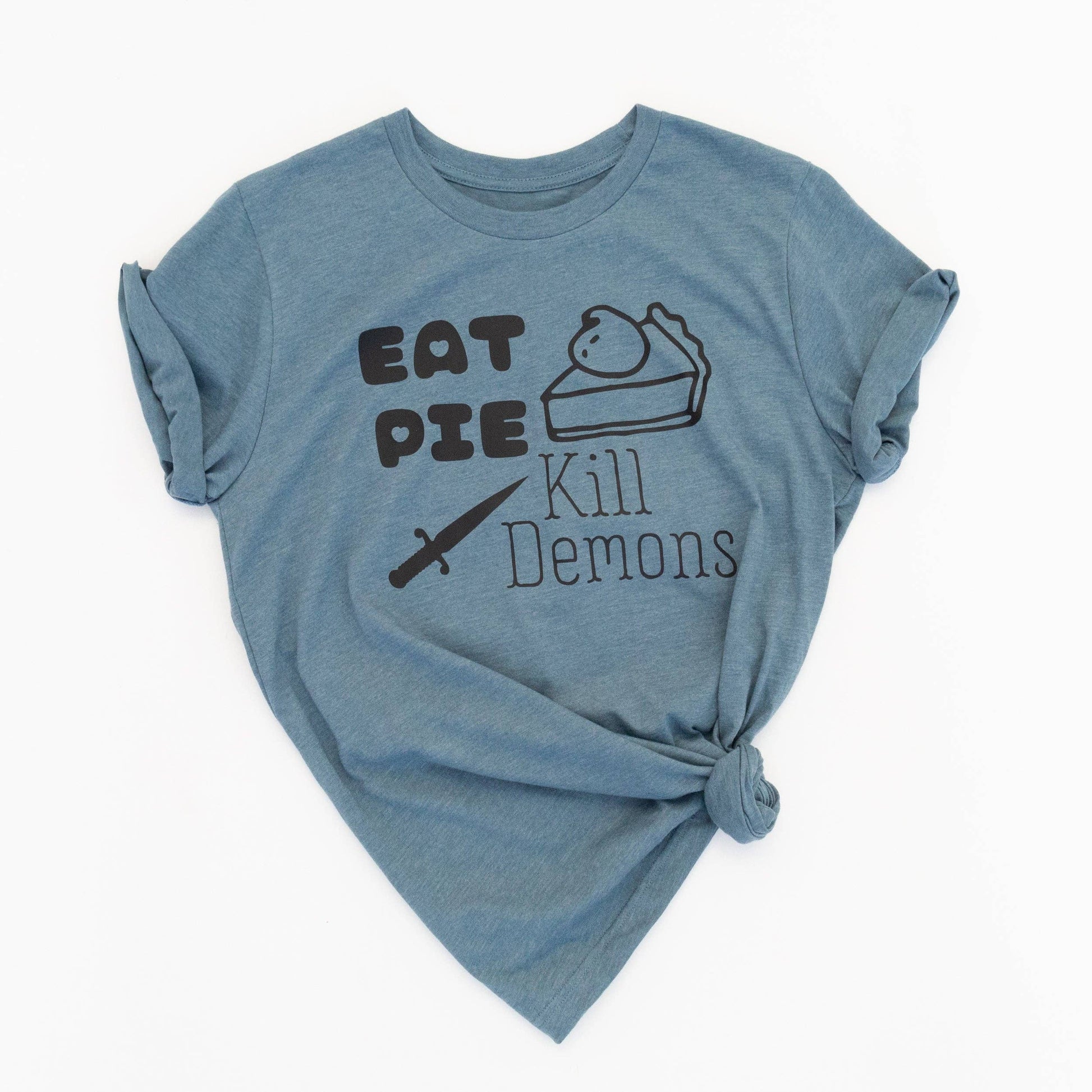 Blue t-shirt with text 'Eat Pie Kill Demons' on a white background