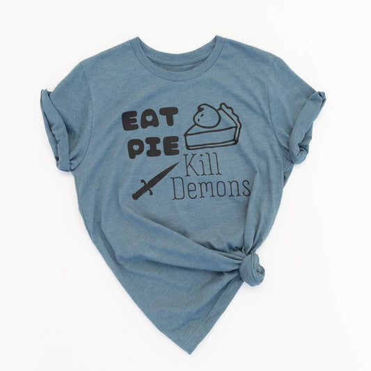 Blue t-shirt with text 'Eat Pie Kill Demons' on a white background
