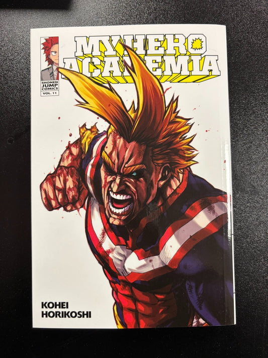 Comic book cover of 'My Hero Academia' with a character in a red and blue outfit on a white background.