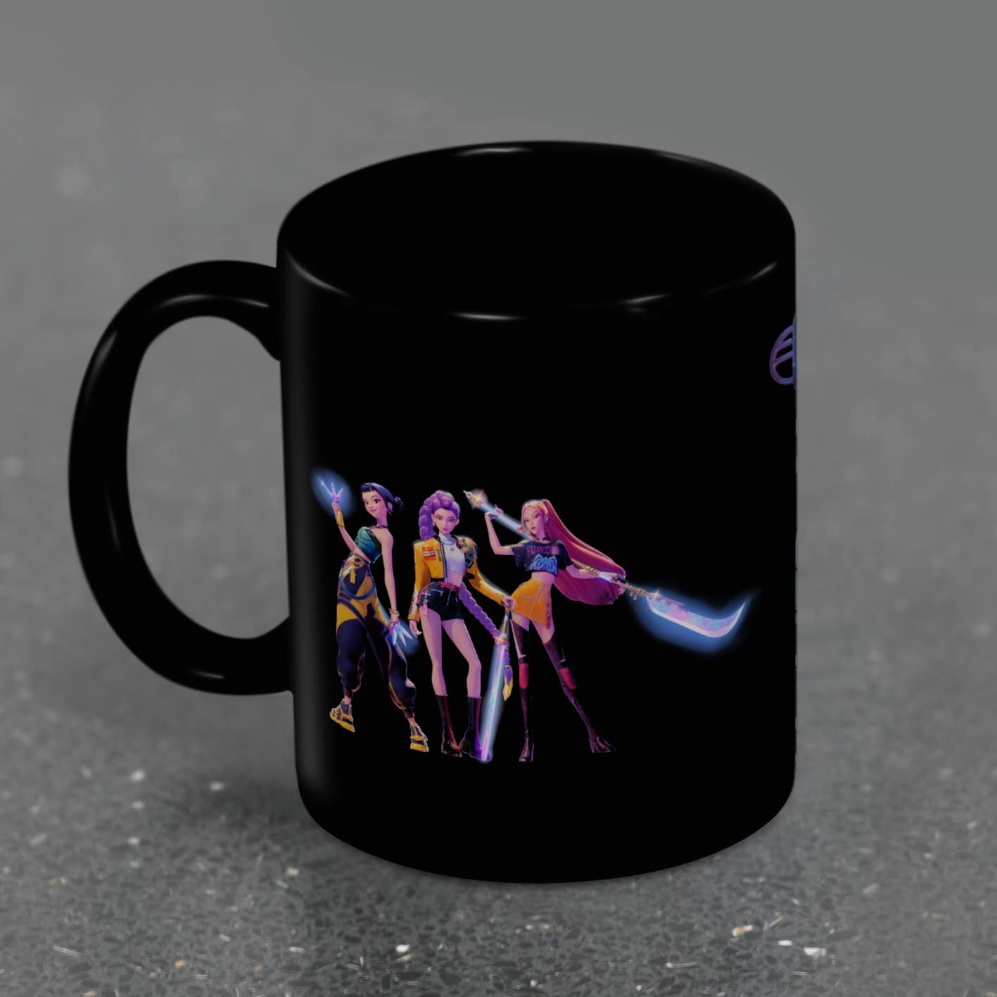 Black mug with colorful character design on a dark gray background
