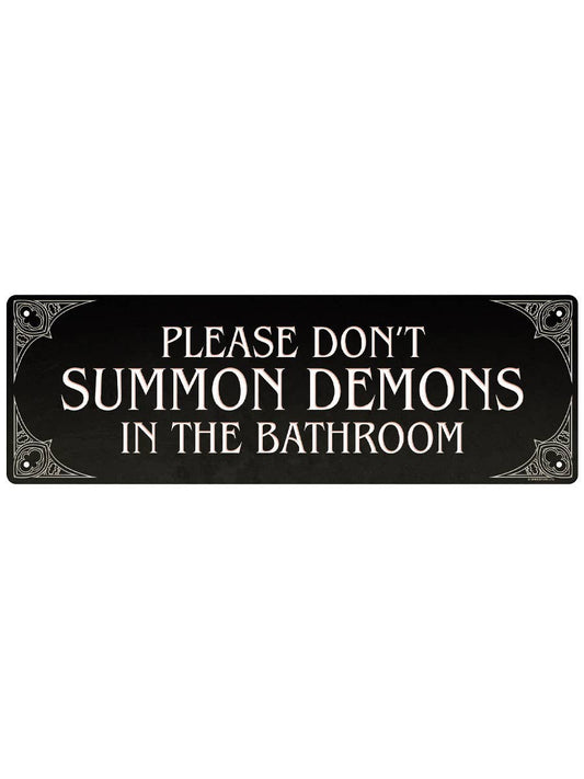 Decorative sign with humorous text 'Please don't summon demons in the bathroom' on a black background.