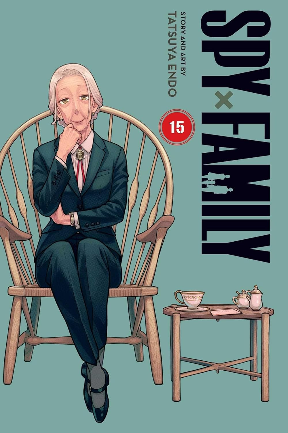 Book cover of 'Spy x Family' with a character sitting in a chair on a teal background