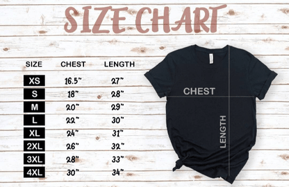 Black t-shirt with size chart on a wooden background