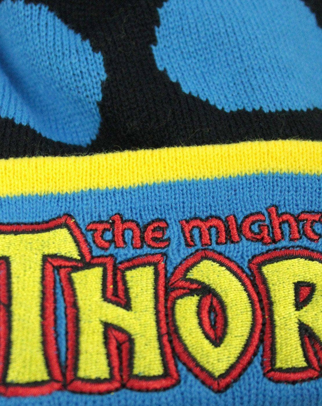 Close-up of a beanie with 'The Mighty Thor' logo on a blue background