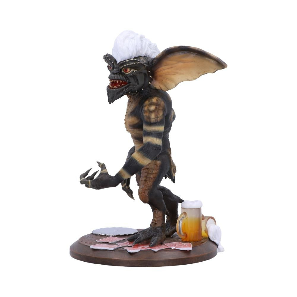 Monster figurine with a beer and napkins on a white background