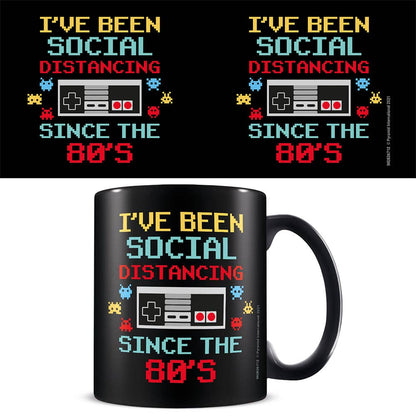 Black mug with retro text design and gaming controller graphic on a white background